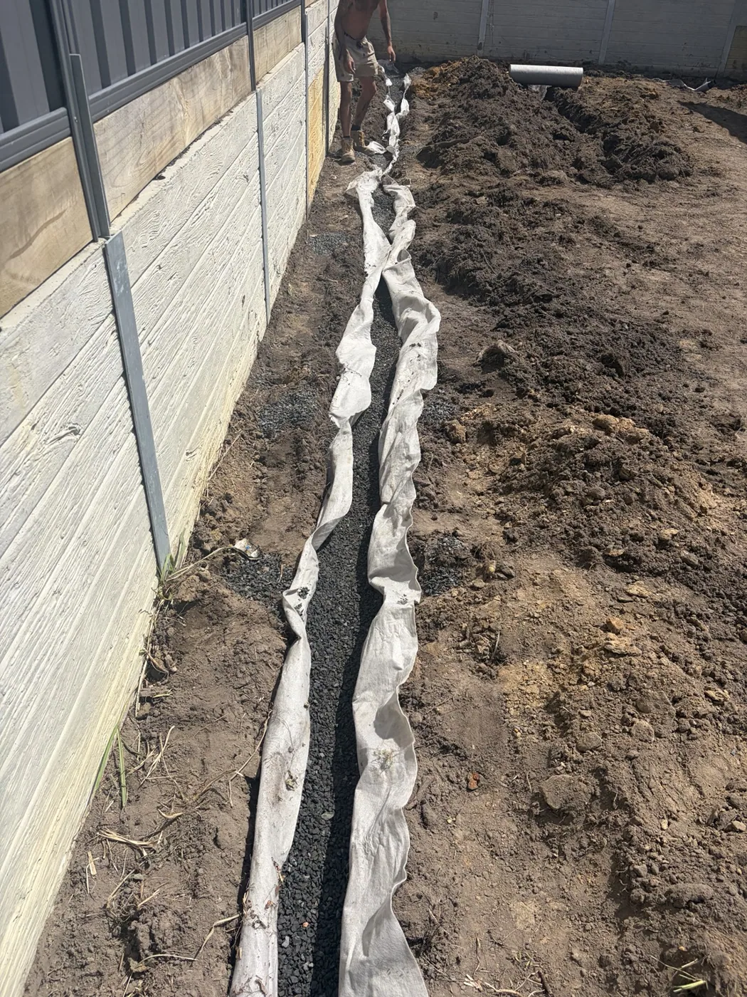 Excavated drainage trench with bedding
